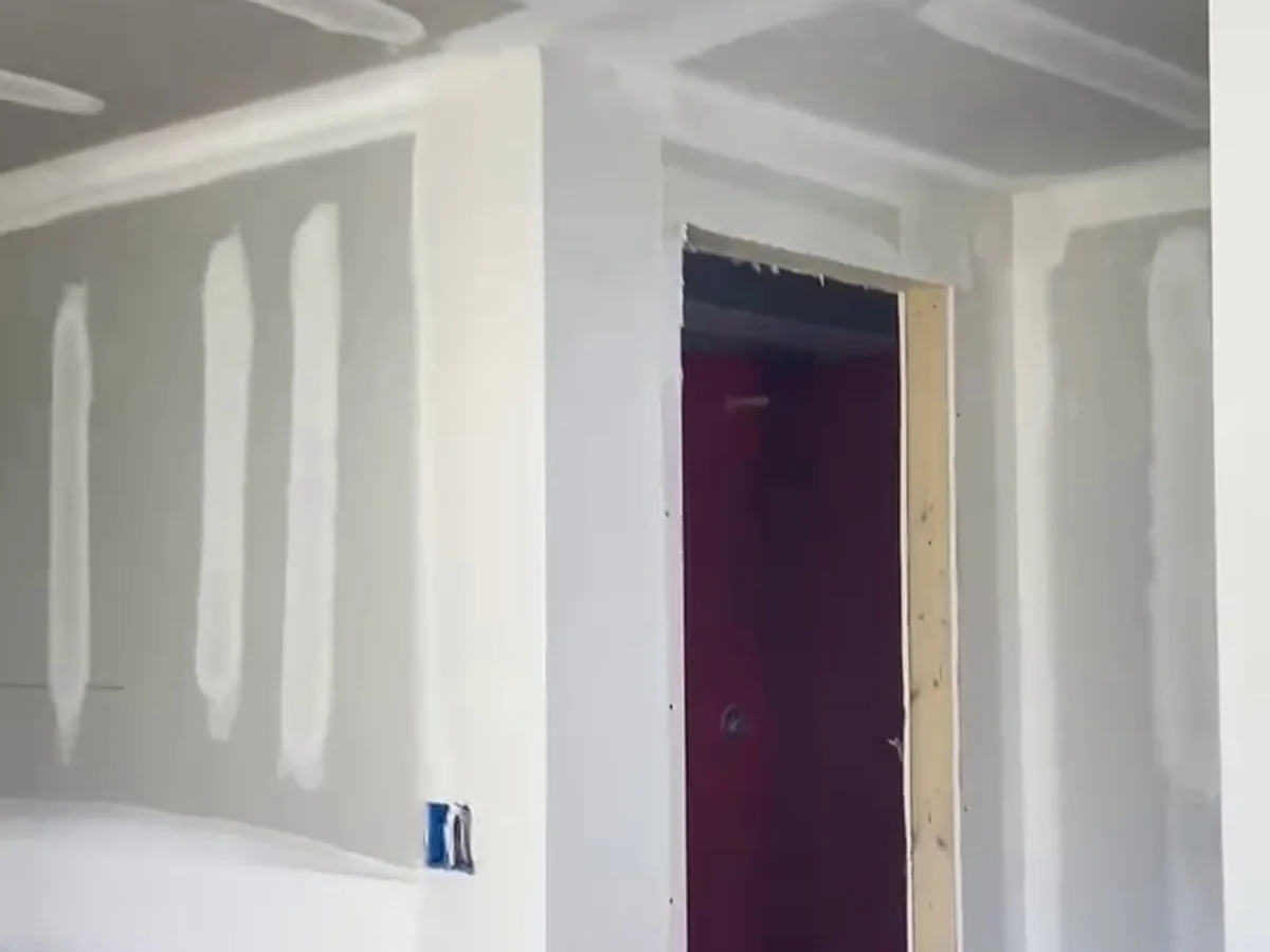 Hallway and door frame taped and ready for paint