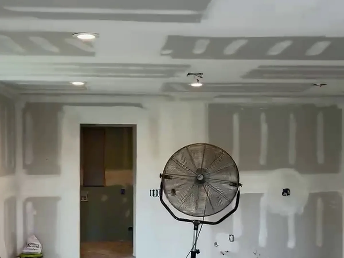 Taped and mudded room drying before sanding